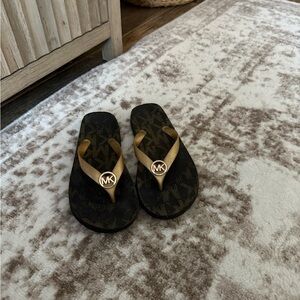 Michael Kors Black and Gold Logo Flip Flops